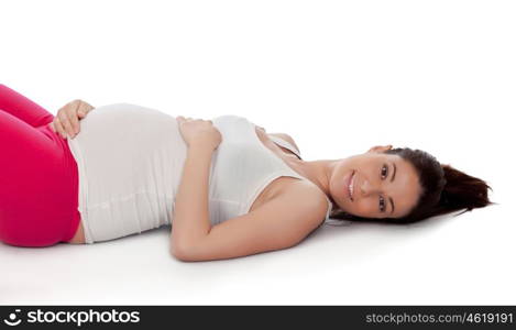 Pretty pregnant woman resting in her training isolated on white background