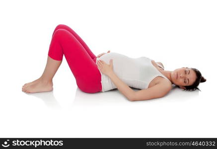 Pretty pregnant woman resting in her training isolated on white background