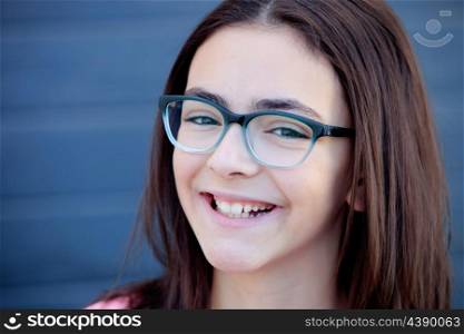 Pretty preteenager girl twelve years old with glasses outside