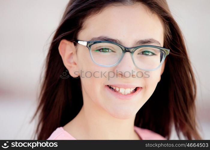 Pretty preteenager girl twelve years old with glasses outside