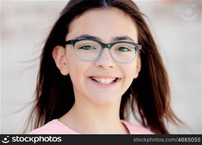 Pretty preteenager girl twelve years old with glasses outside