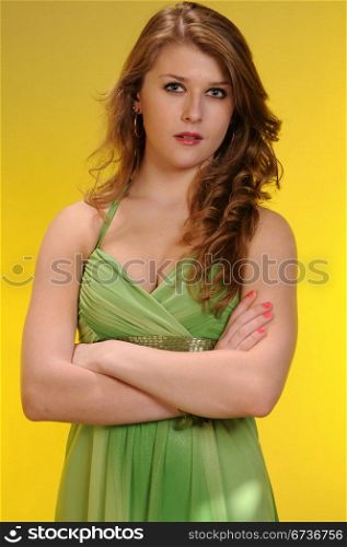 Pretty redheaded teenager in a green dress