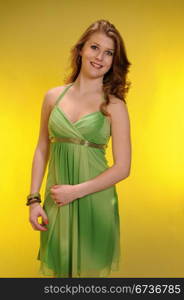 Pretty redheaded teenager in a green dress