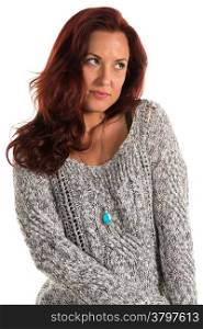 Pretty redheaded woman in a gray sweater