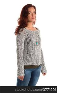 Pretty redheaded woman in a gray sweater and jeans