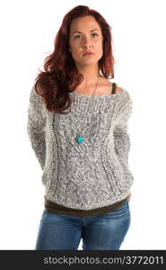 Pretty redheaded woman in a gray sweater and jeans