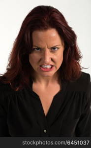 Pretty redheaded woman in a purple blouse