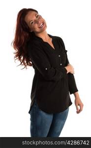 Pretty redheaded woman in a purple blouse and jeans