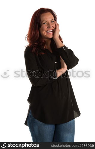 Pretty redheaded woman in a purple blouse and jeans