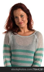 Pretty redheaded woman in a striped sweater