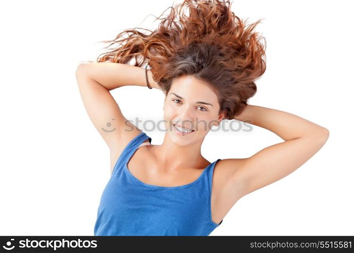 Pretty relaxed woman with long hair on the floor on white background