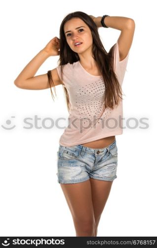 Pretty Romanian brunette in a pink tee shirt and denim shorts