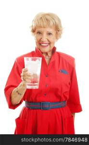 Pretty senior woman drinking a large glass of ice water. Isolated on white.