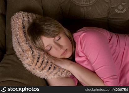 pretty sleeping woman at sofa