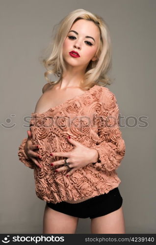 Pretty slender blonde in a vintage ruffled blouse