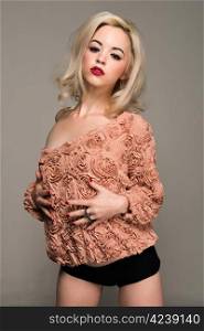 Pretty slender blonde in a vintage ruffled blouse