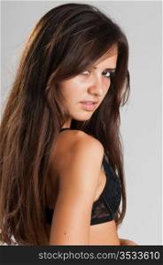 Pretty slender Romanian brunette in black lingerie