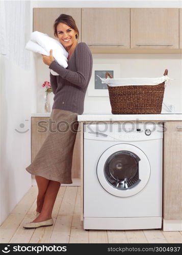 pretty smiling girl in the laundry room l