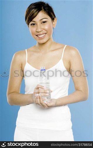 Pretty Sportswoman with Water Bottle