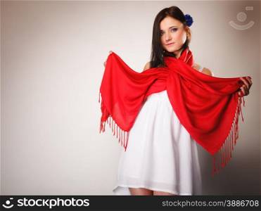 Pretty summer woman fashionable girl in white dress with red shawl on gray background. Fashion photo