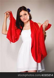 Pretty summer woman fashionable girl in white dress with red shawl on gray background. Fashion photo