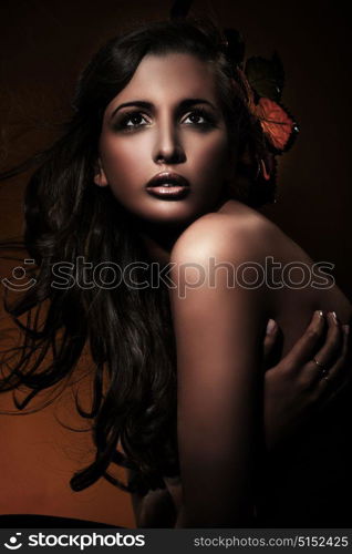 Pretty, tawny woman with a plain complexion