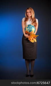 pretty teacher with globe and maple leaves, blue background