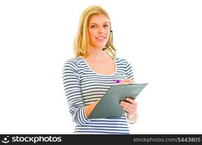 Pretty teen girl in headset writing in clipboard isolated on white &#xA;