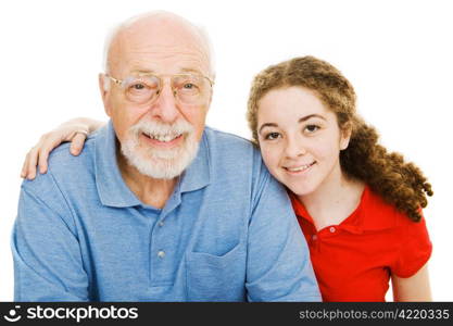 Pretty teen girl spending time with her handsome grandfather. Isolated on white.