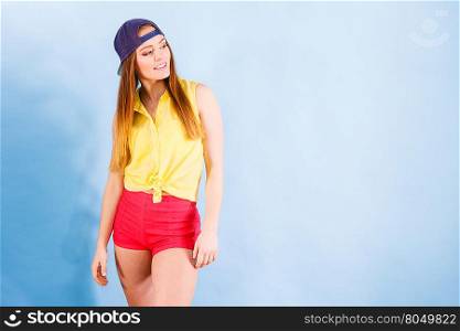 Pretty teenage girl in fashionable clothes.. Fashion of teens. Beauty teenage girl presenting urban style. Fashionable young woman posing in stylish casual clothes.