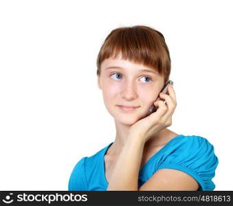 Pretty teenage girl with mobile phone in studio