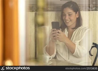 pretty teenager browsing her phone