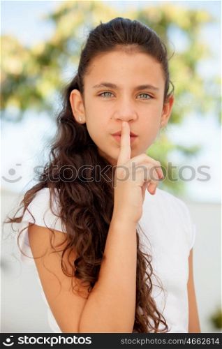 Pretty teenager girl ordering silence outdoor