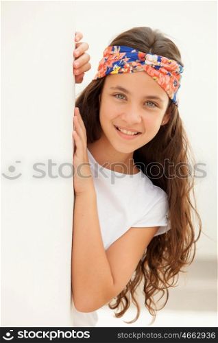 Pretty teenager girl with a flowered headband outdoor
