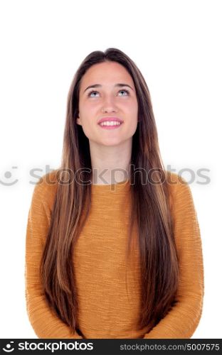 Pretty teenager girl with sixteen years old looking up isolated on a white background