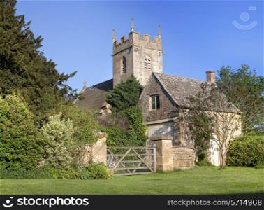 Pretty village church and cottage at Cutsdean, Gloucestershire, England.
