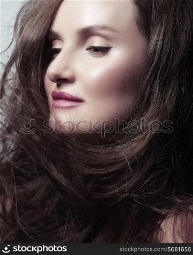 Pretty Woman Brunette with Blowing Healthy Hair
