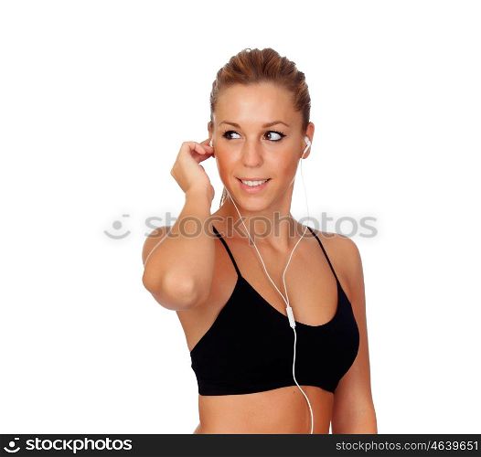 Pretty woman doing fitness istening music with headphones on white background isolated
