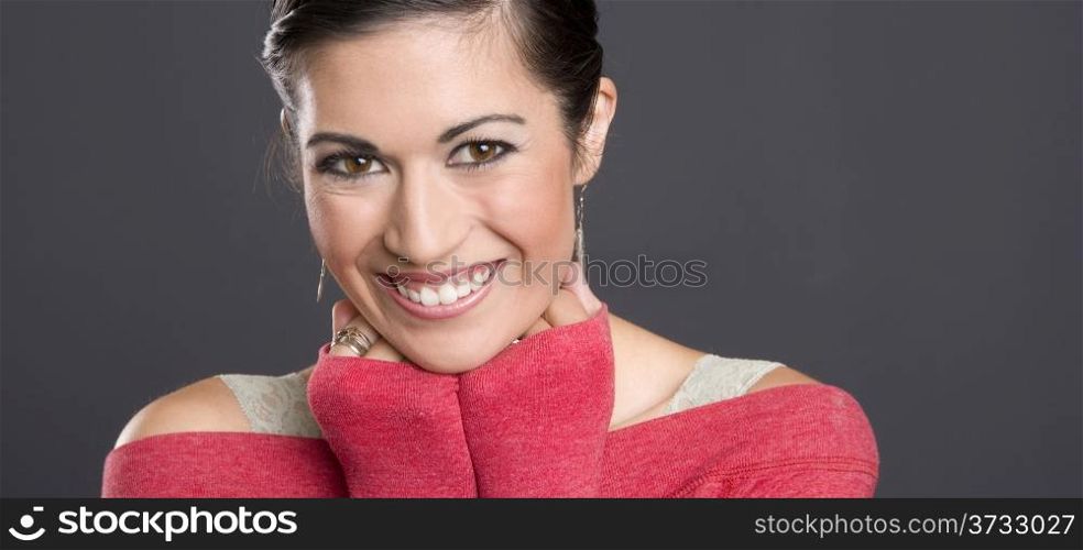 Pretty Woman in a red sweater looking at the camera