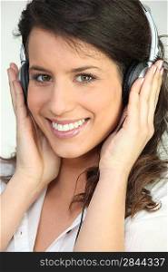 Pretty woman listening to headphones