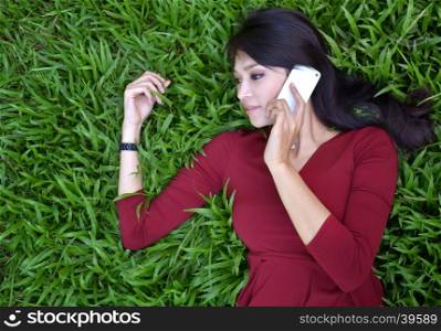 pretty woman making a phone call in the garden