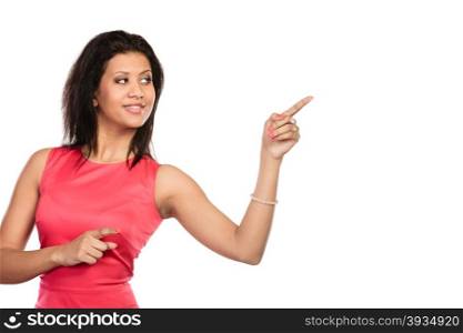 Pretty woman pointing at empty blank copy space.. Portrait of pretty fashion mixed race woman pointing at empty blank copy space. Young girl isolated on white. Advertisement.