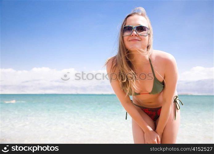 Pretty Woman Portrait On The Sea Background