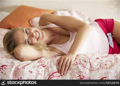Pretty Woman Relaxing On Bed