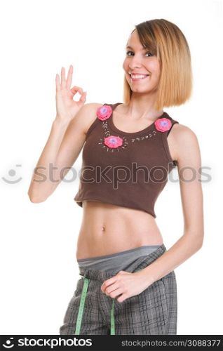 Pretty woman shows her weight loss wearing measure tapes isolated on white
