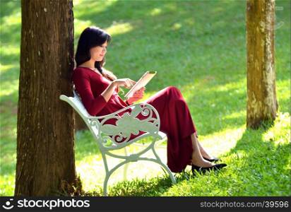 pretty woman using tablet in the garden