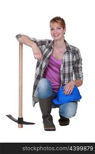 Pretty woman with a pickaxe