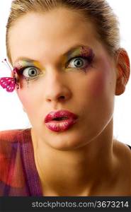 pretty woman with artistic make up making a surprised face