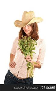 Pretty woman with cowboy hat and flowers