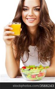 pretty woman with juice and salad on white background